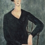 Femme assise à la robe bleue