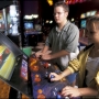 Austin Texas USA - Middle school friends play video game at arcade 